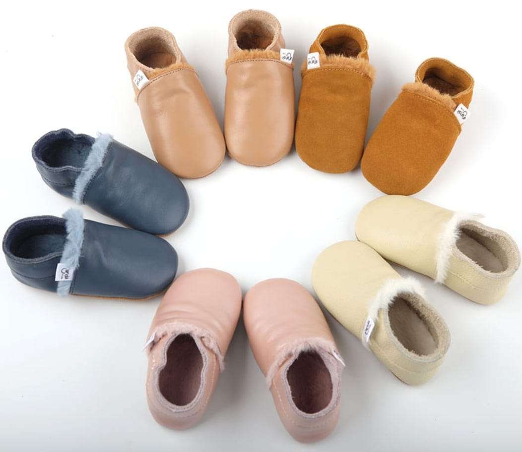 Ergonomic winter toddler shoes in various colors, including blue, rose, cream, latte, and caramel, designed for warmth and safety.