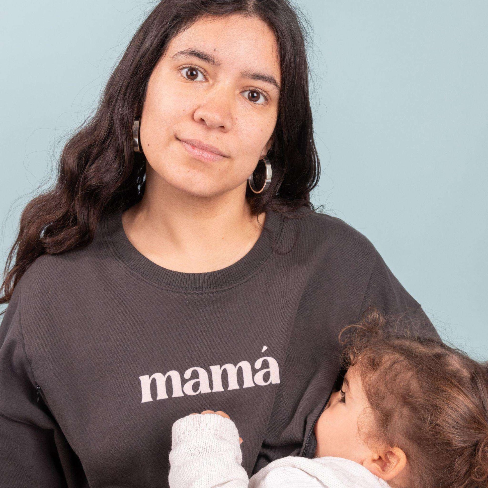Dark gray nursing sweatshirt with "mamá" flock print, featuring side zippers for easy breastfeeding.