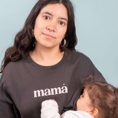 Dark gray nursing sweatshirt with "mamá" flock print, featuring side zippers for easy breastfeeding.