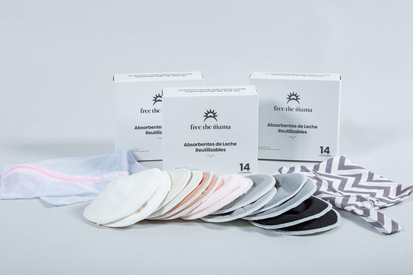 Absorbentes de leche reutilizables con diseño anatómico y capa impermeable, en varios colores, incluyen bolsa de lavado y almacenamiento.