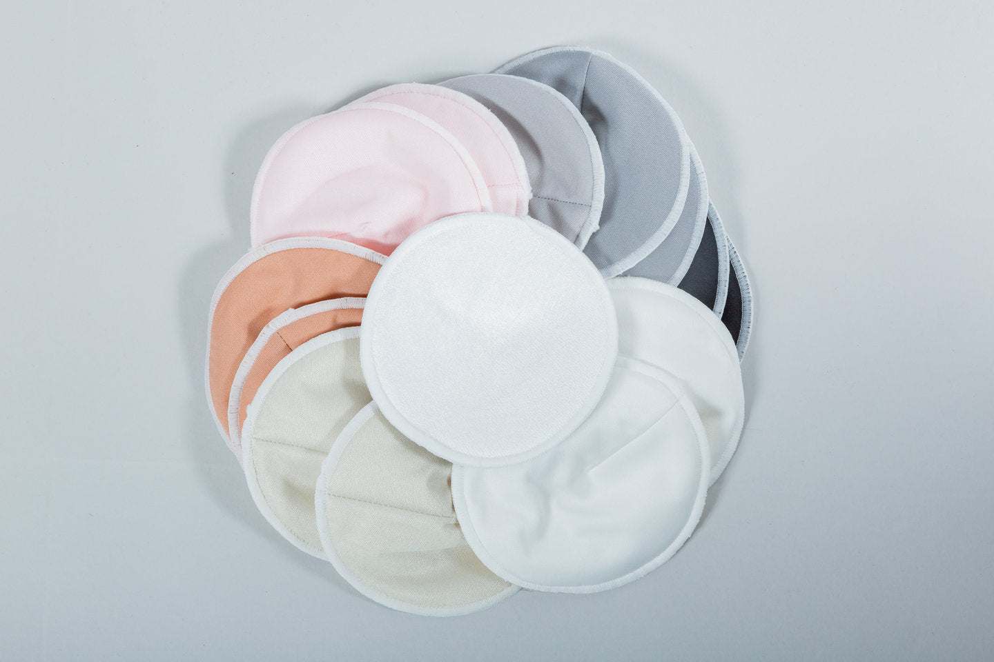 Absorbentes de leche reutilizables en varios colores, suaves y ultra absorbentes para lactancia.