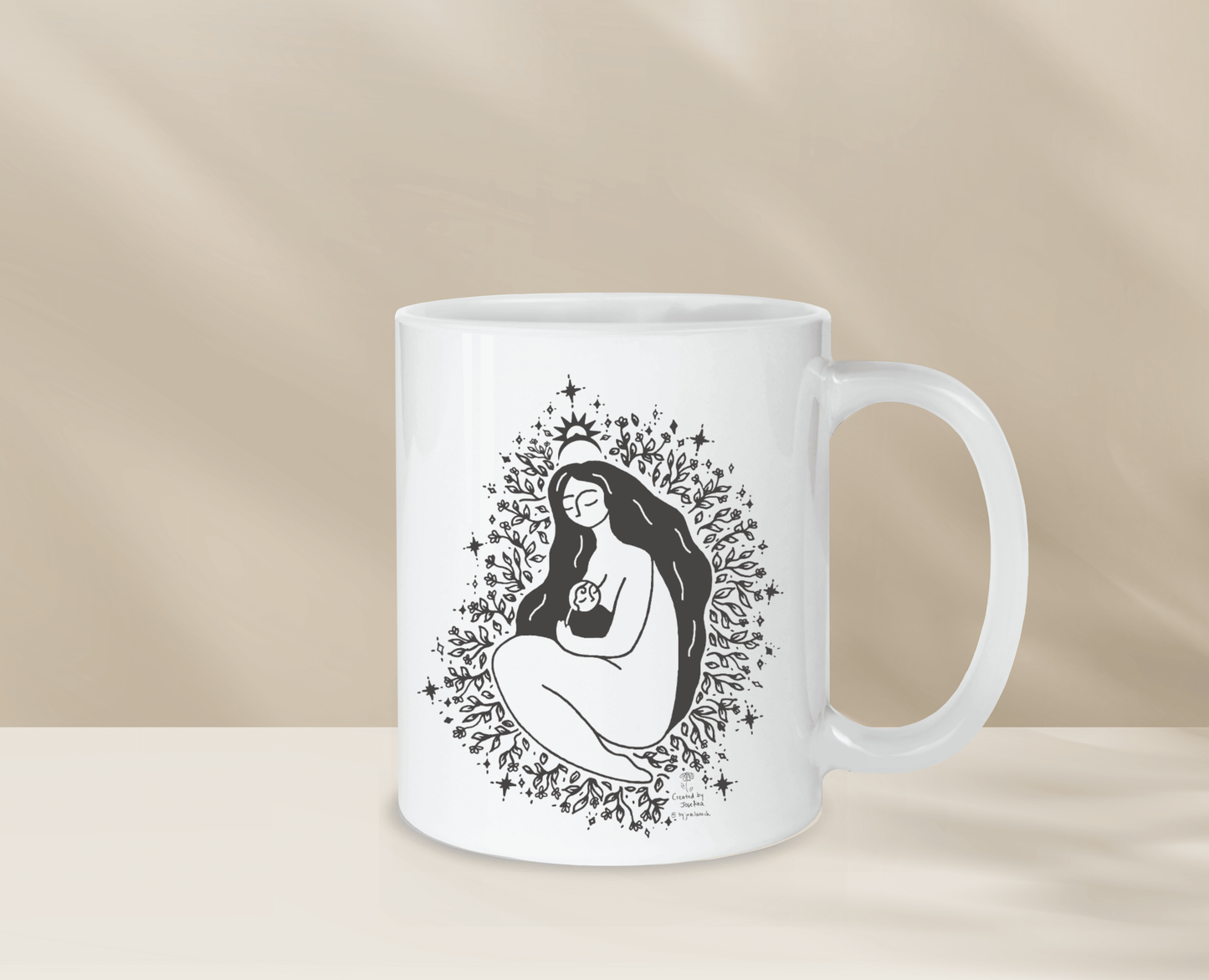 Decorative mug with unique freethemama design, perfect for morning coffee.