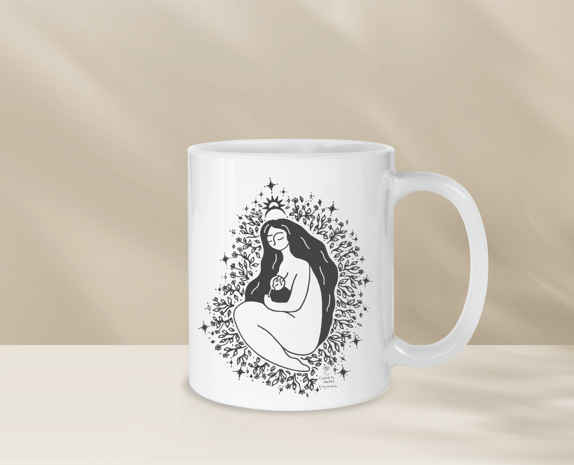Decorative mug with unique freethemama design, perfect for morning coffee.