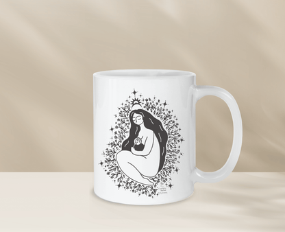 Decorative mug with unique freethemama design, perfect for morning coffee.