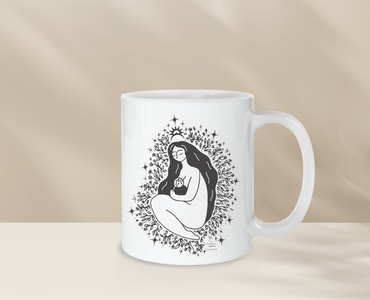 Decorative mug with unique freethemama design, perfect for morning coffee.