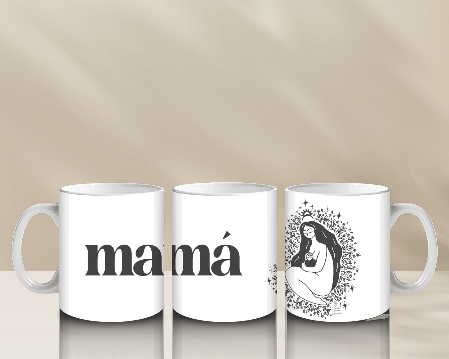 Three white mugs with the word "mamá" and an artistic design of a mother and child.
