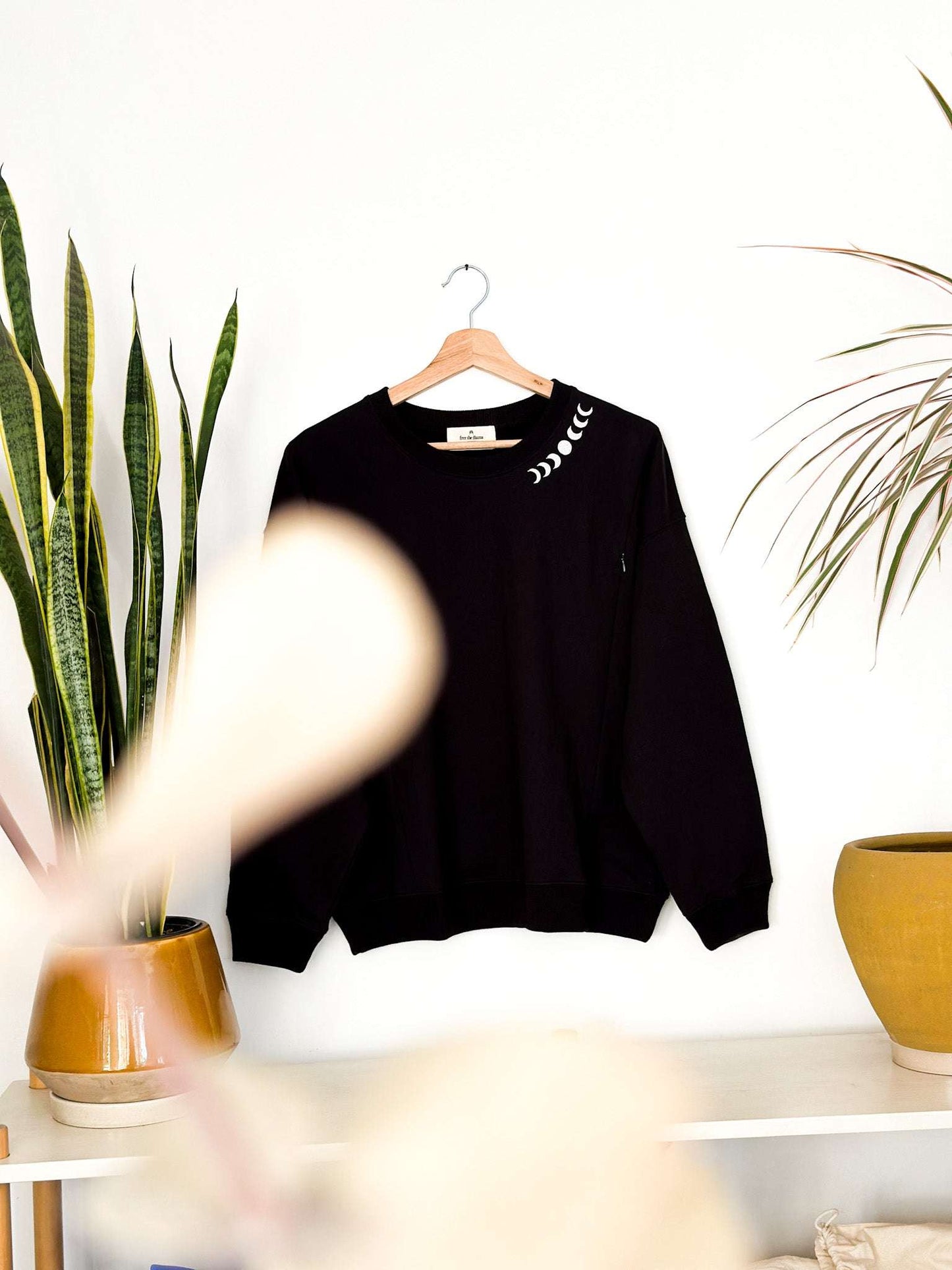 Black maternity nursing sweatshirt with lunar embroidery, made from soft Pima cotton.