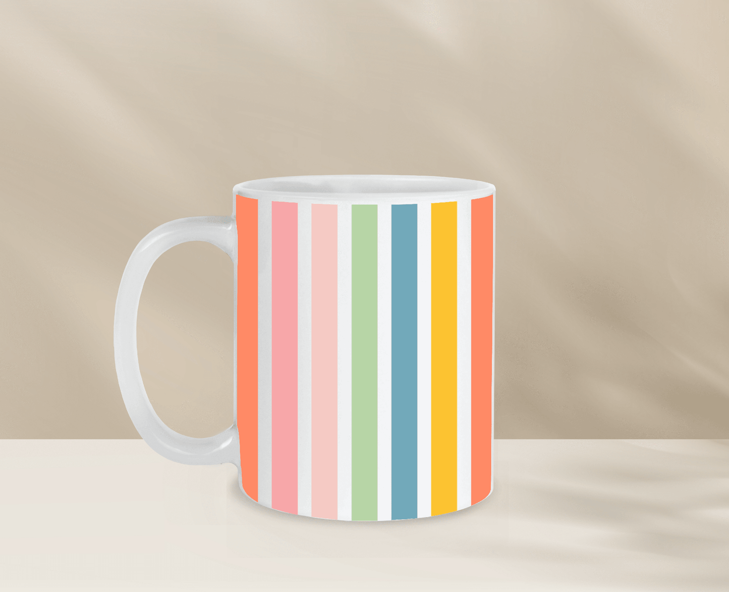 Colorful striped coffee mug on neutral background.
