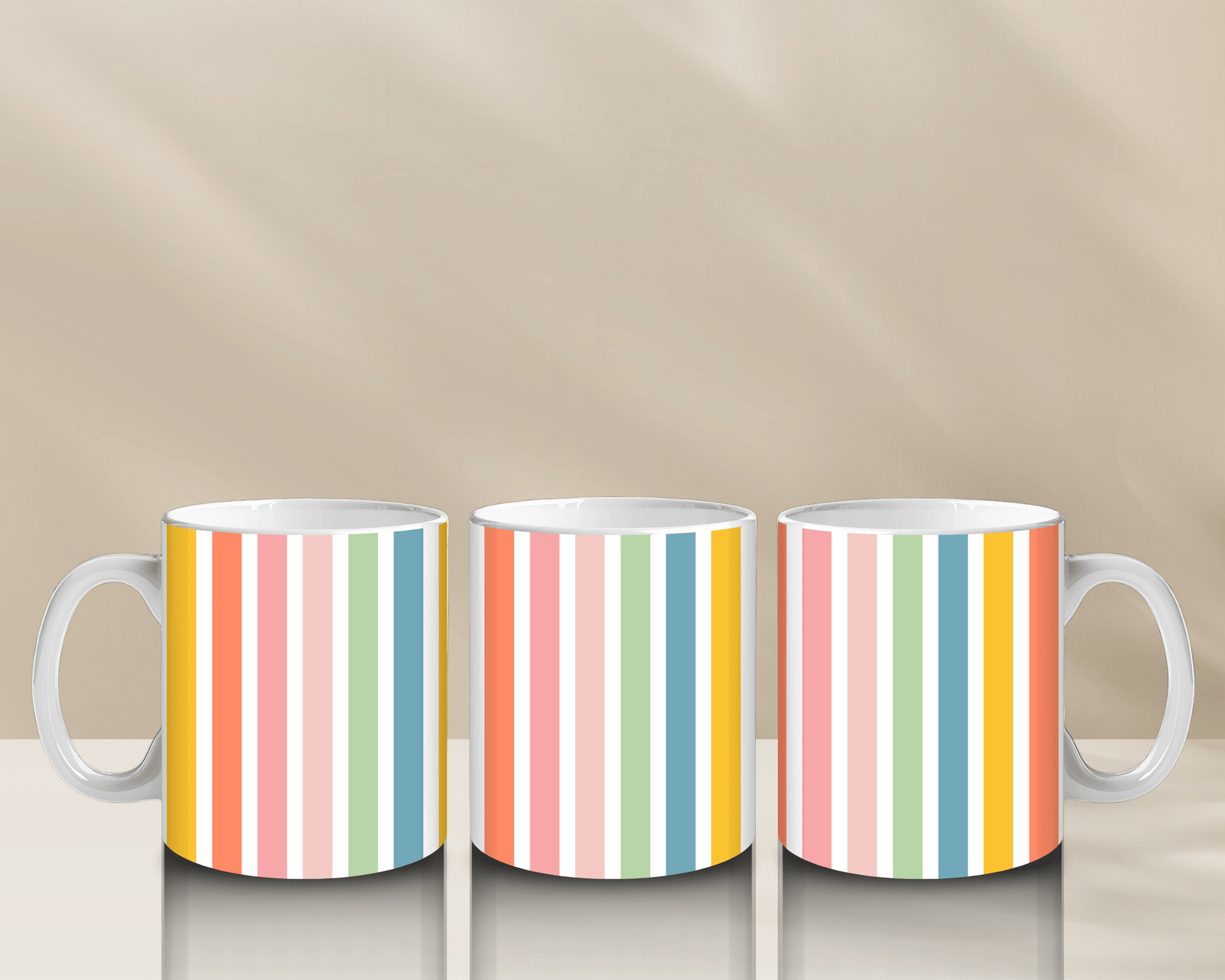 Colorful striped coffee mugs on a reflective surface.